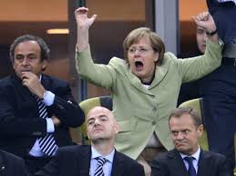 Merkel at German football match.